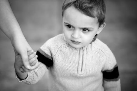 child holding parent's hand