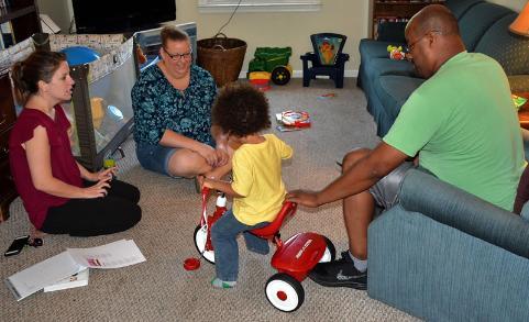 EI Service Provider during a visit with families