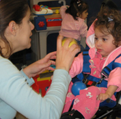 adult playing with a toddler