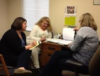 3 women having a meeting