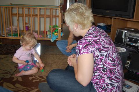 Early Intervention professional with child in their home environment